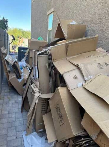 Household items awaiting removal beside a home
