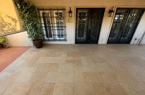 Open tiled patio outside a home